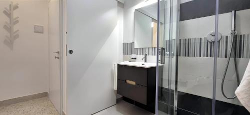 a bathroom with a sink and a shower at Casa Sunrise - The Guest House in Sciacca
