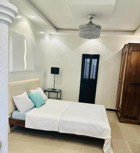 Ένα ή περισσότερα κρεβάτια σε δωμάτιο στο Rooftop Studio with Private Sun Terrace