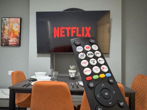 a remote control sitting on top of a table at Wellesley Retreat 4BR Entire Home in Middlesbrough