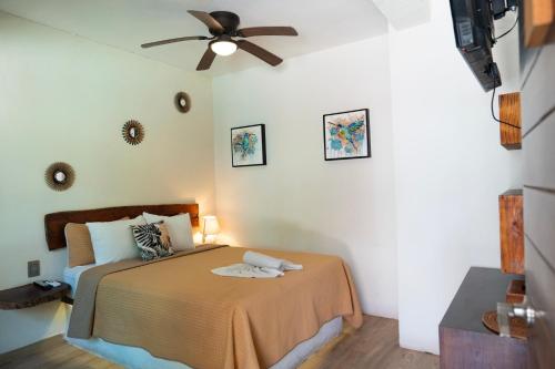 Ένα ή περισσότερα κρεβάτια σε δωμάτιο στο Hotel Diosa del Agua Bacalar