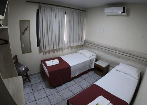 Postel nebo postele na pokoji v ubytování Hotel Colonial