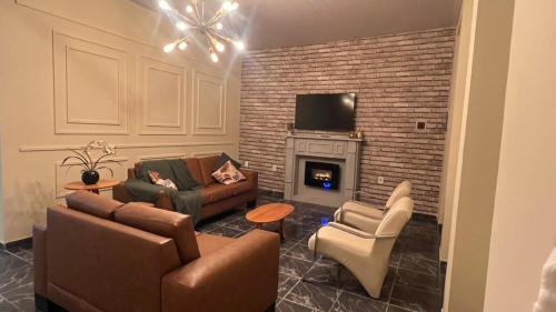 a living room with two couches and a fireplace at Casa Naza in Areia