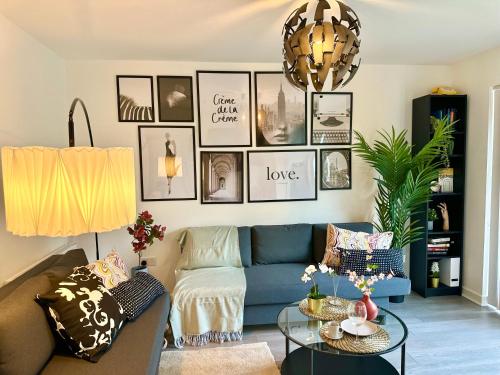 a living room with a couch and a table at Newbuild Riverview 3BDR House near Glasgow in Dalmuir
