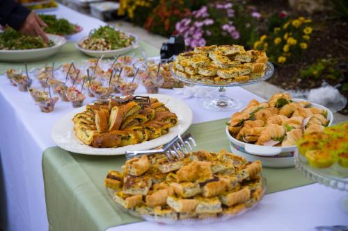 a table with many plates of food on it at Azienda agrituristica Di Fiore in Morcone