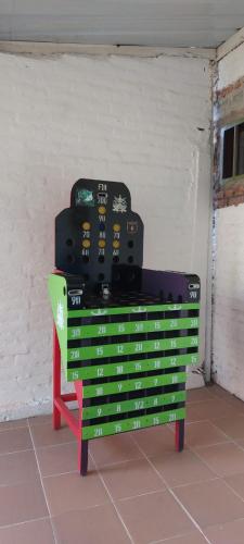 a pile of suitcases sitting on top of a shelf at Cabaña Ana Emilia, lugar mágico in Ginebra