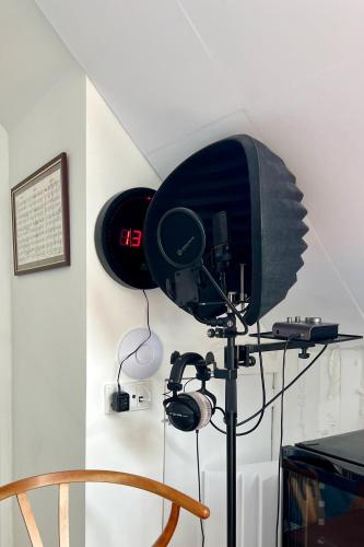 a camera on a tripod in a room at K L O S T E R E T - The Luxurious Townhouse of Copenhagen in Copenhagen