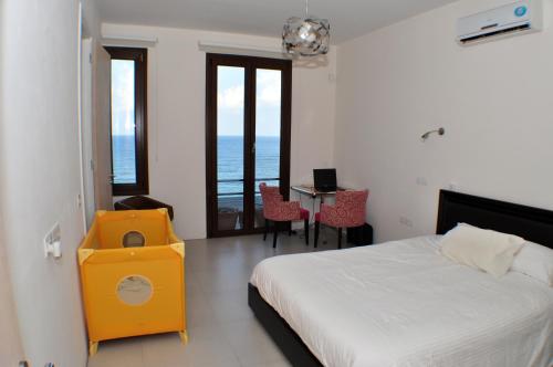 Postel nebo postele na pokoji v ubytování Beach Villa Pantheon