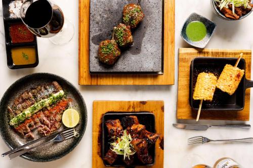 a table with plates of food and a plate of food at Radisson Blu Hotel, London Leicester Square in London