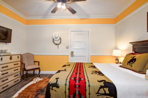a bedroom with a bed and a ceiling fan at Hotel St. Michael, BW Premier Collection in Prescott