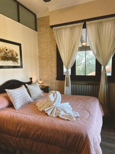 Ένα ή περισσότερα κρεβάτια σε δωμάτιο στο Juliette Posada Boutique Ex Posada La Villa
