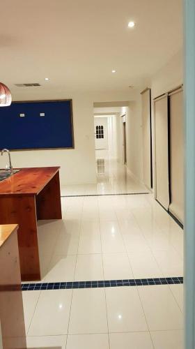 a large empty room with a desk in a room at Guest Room in Joan in St Albans