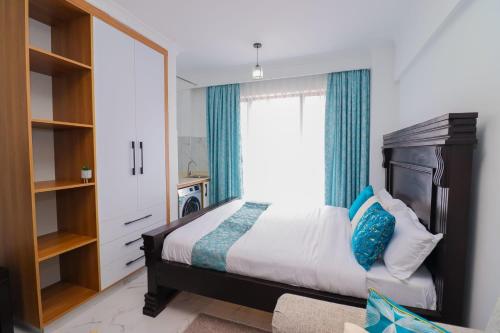 Ένα ή περισσότερα κρεβάτια σε δωμάτιο στο Dhahabu private Apartment