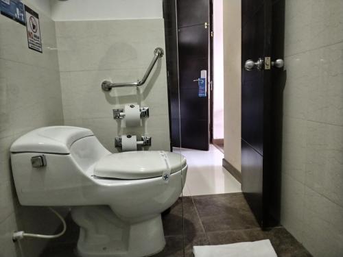 a bathroom with a toilet in a bathroom stall at Santa Maria de Leyva hotel boutique in Villa de Leyva