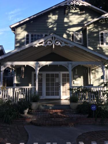 a house with a front door and a porch at Elaine's Hollywood Bed & Breakfast in Los Angeles
