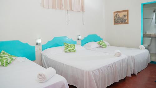 Una cama o camas en una habitación de Hotel Petenchel