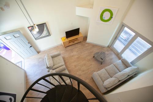 an overhead view of a living room with a couch and a television at Onyx Hotels in Austin
