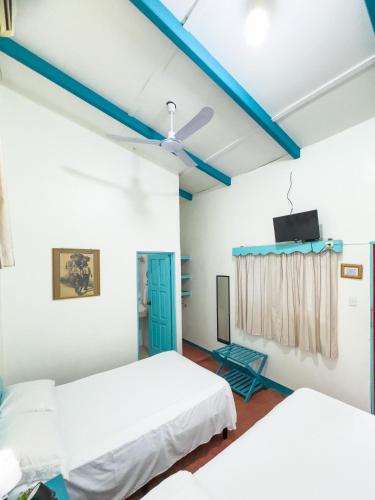 Una cama o camas en una habitación de Hotel Petenchel