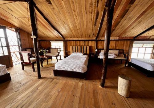 Postel nebo postele na pokoji v ubytování Cabaña en el Campo Malchinguí WIFI 24 horas