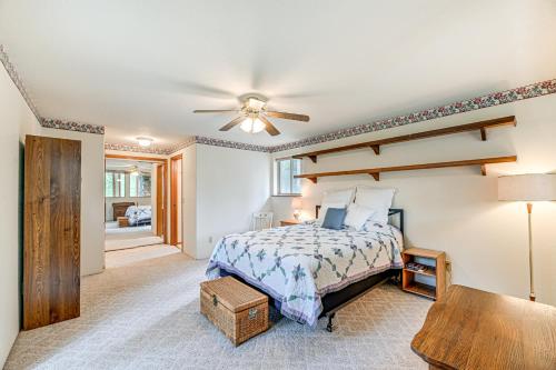 a bedroom with a bed and a ceiling fan at Close to Wine Trail Home with Deck Near Applegate in Grants Pass