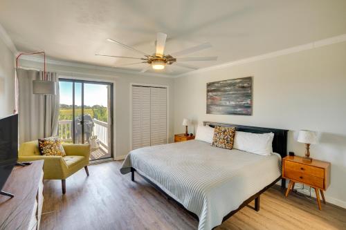 a bedroom with a bed and a ceiling fan at St Helena Island Retreat with Deck Walk to Beach in Oceanmarsh Subdivision