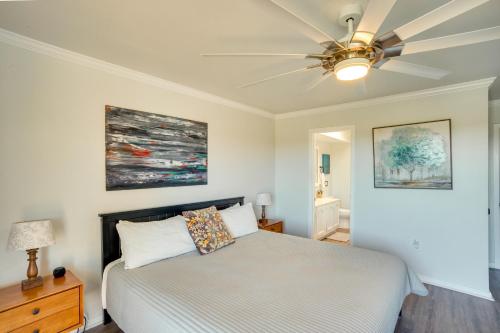 a bedroom with a bed and a ceiling fan at St Helena Island Retreat with Deck Walk to Beach in Oceanmarsh Subdivision
