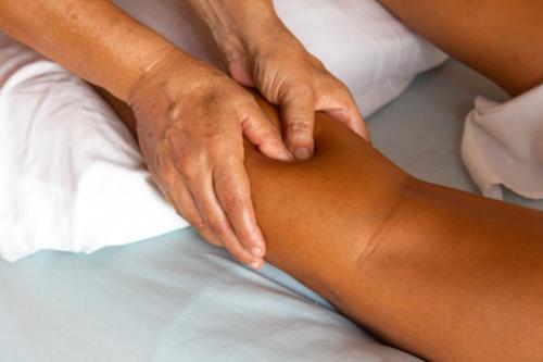 a woman with her hands on a persons arm at Hotel Tres Santos in Troncones
