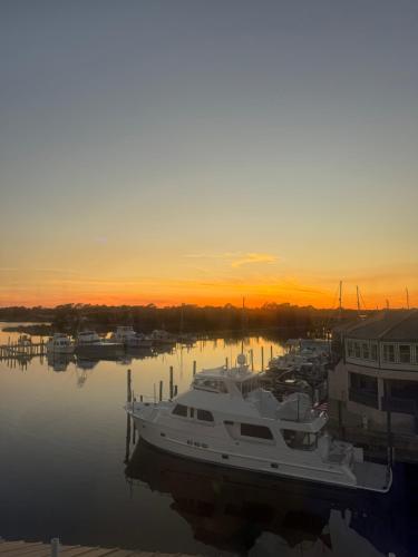 a boat docked in a marina at sunset at The Moorings Hotel and Marina of Carrabelle in Davis Island