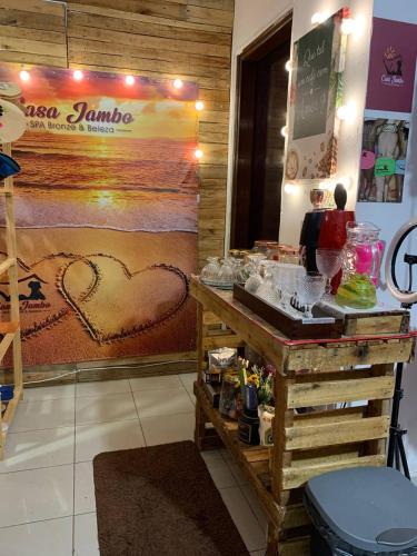 a counter in a store with a sign with hearts on it at Hostel Casa Jambo Guaruja in Guarujá