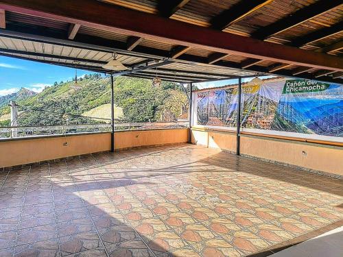 an empty room with a view of a mountain at Apartamento Dúplex con Terraza y Jacuzzi en Aratoca in Aratoca