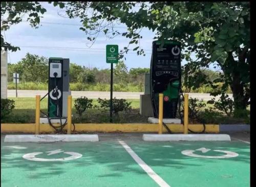 a parking lot with a charging station and a parking meter at KK'S Elite Escape with private beach in Richmond