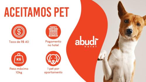 a dog standing next to a label for a asthma pet at Abudi Hotel in Cuiabá