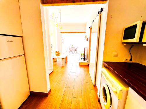 a hallway with a living room and a kitchen at apartamento Chilches playa in Chilches