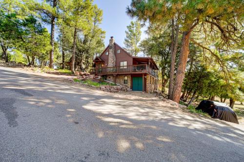 a house on the side of a road at Hot Tub, Game Room Dog-Friendly Pine Cabin! in Pine