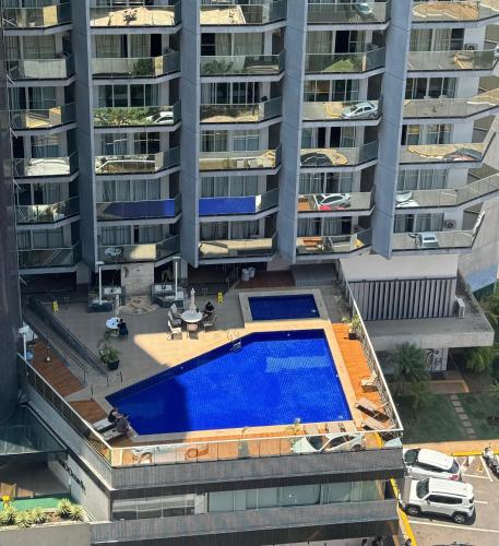 an overhead view of an apartment complex with a swimming pool at MANHATTAN - JK APART Hotel in Brasilia
