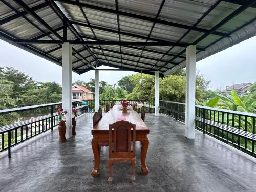 a wooden table on top of a building at JJ&J Garden in Pai