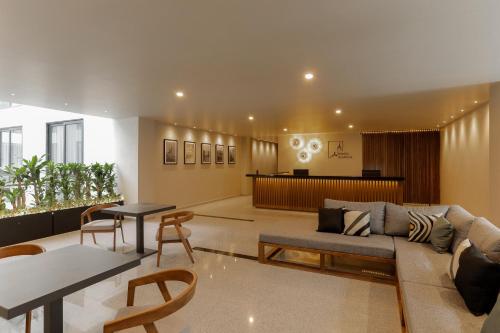 a living room with a couch and a table at Punta Alameda in Mexico City