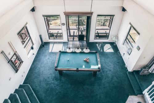 an overhead view of a pool table in a house at Breathtaking view of the Hills with HotTub, Pool and Pool Table in Marble Mountain
