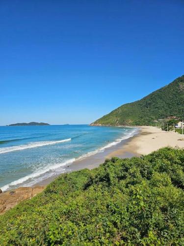 a view of a beach with the ocean at Nosso Mar in Florianópolis