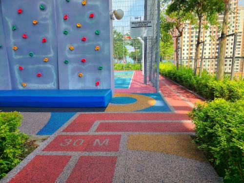 a room with a climbing wall in a building at View of the whole Georgetown in George Town