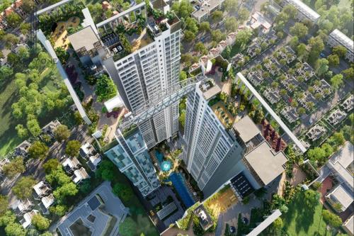 an overhead view of a large apartment building with a pool at Happy One Central in Ga Phú Văn