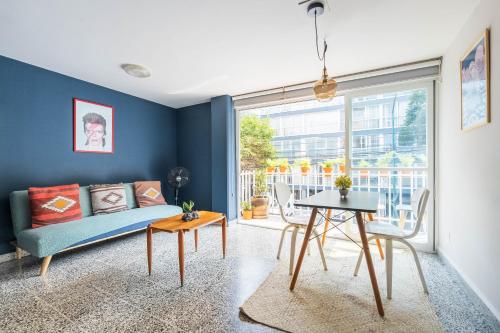 a living room with a couch and a table at nice apt. Roma CDMX :) in Mexico City