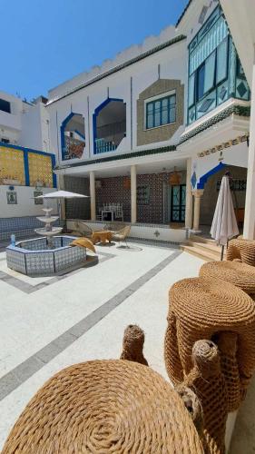 a large building with a large yard with a patio at Dar Morjana in Sousse