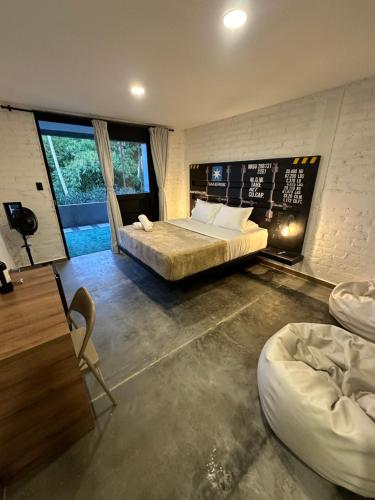 Postel nebo postele na pokoji v ubytování Eco Hotel La Colina Mirador