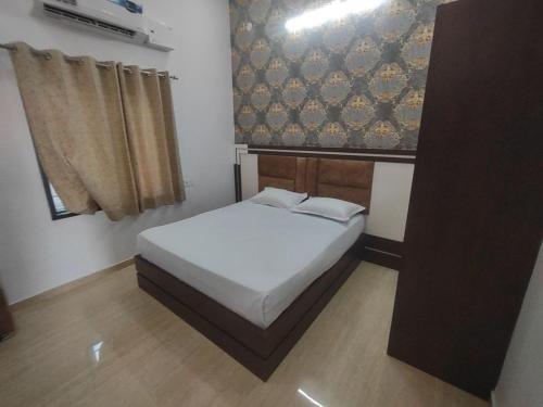 Cama o camas de una habitación en Sangam Hotel