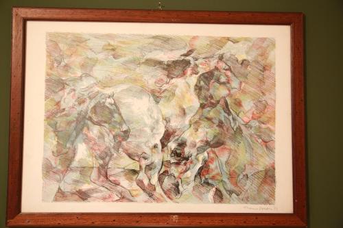 a painting of an elephant in a wooden frame at Bilocale Indipendente in Milan