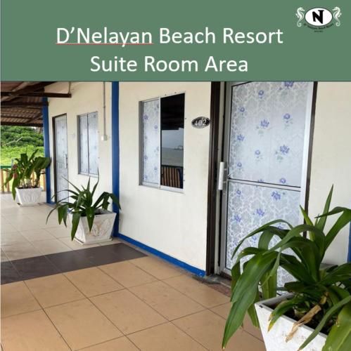 a front door of a resort suite room area with plants at DNELAYAN BEACH RESORT in Masjid Tanah