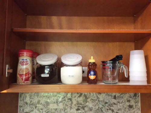 a shelf with spices and other items on it at Couple's Retreat - Get Away to Turtle Bay in Kahuku