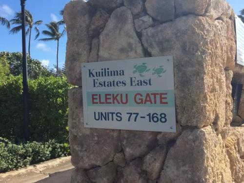 a sign on the side of a rock at Couple's Retreat - Get Away to Turtle Bay in Kahuku