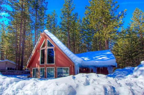 a red barn with snow on the roof at Snowshoe Chalet cabin in South Lake Tahoe