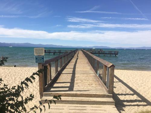 a wooden boardwalk leading to the ocean on a beach at LLC0804 - Lucky Lady 404 in South Lake Tahoe